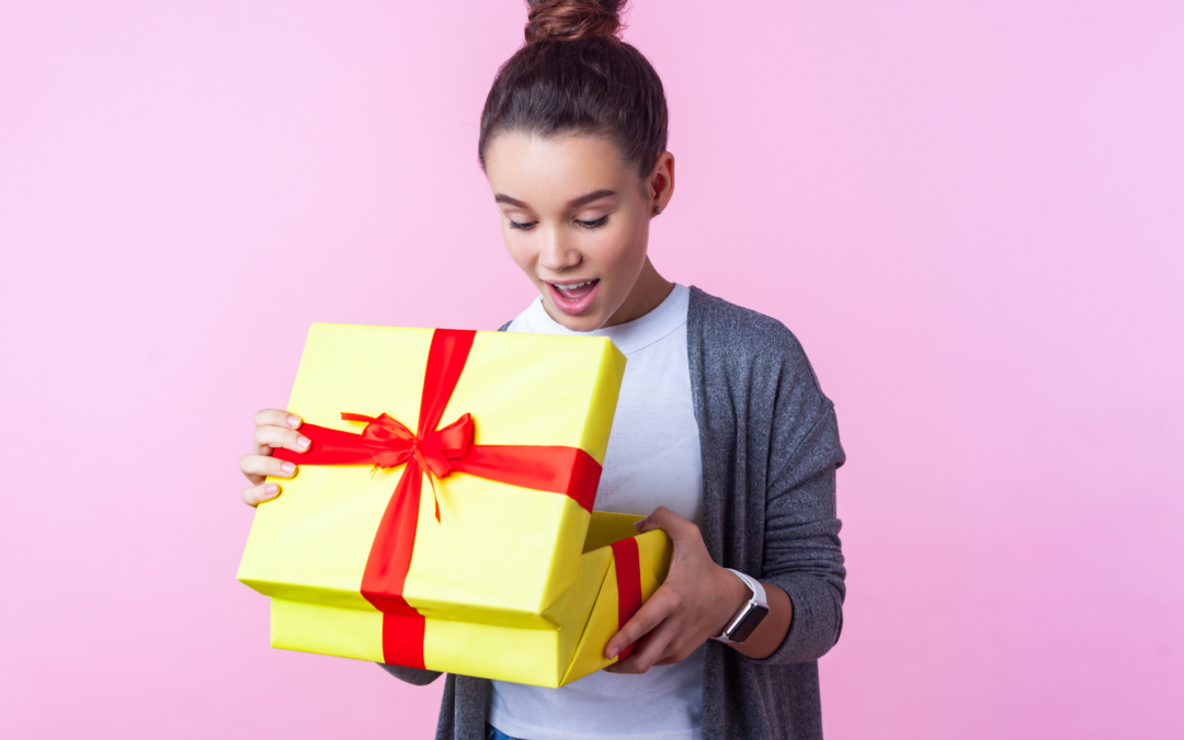 Teen Girl Opening a Holiday gift